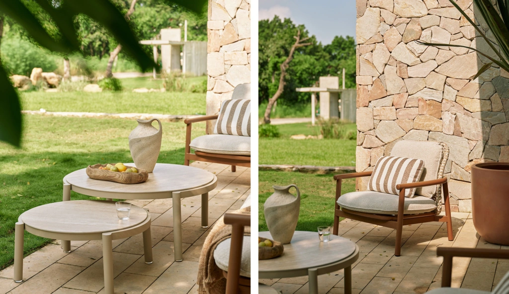 Lille ceramic coffee tables nested beside the lounge armchair on a stone terrace